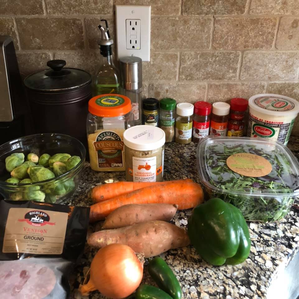 Photo of ingredients: bell pepper, carrots, sweet potato, brussels spouts, etc.