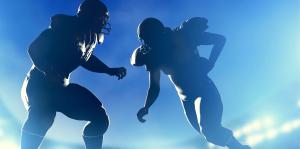 Two football players are shown in silhouette against blue background.