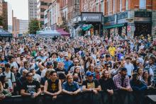 A large crowd gathers on N Pearl St in downtown Albany in front of PearlPalooza stage.