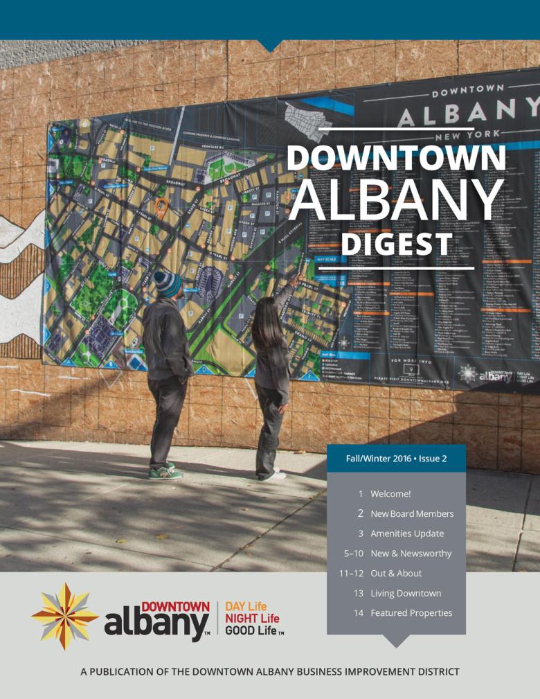 Downton Albany Digest cover, including an image of passerby's looking at a large, street-sized map of the district pasted on the side of a building.  