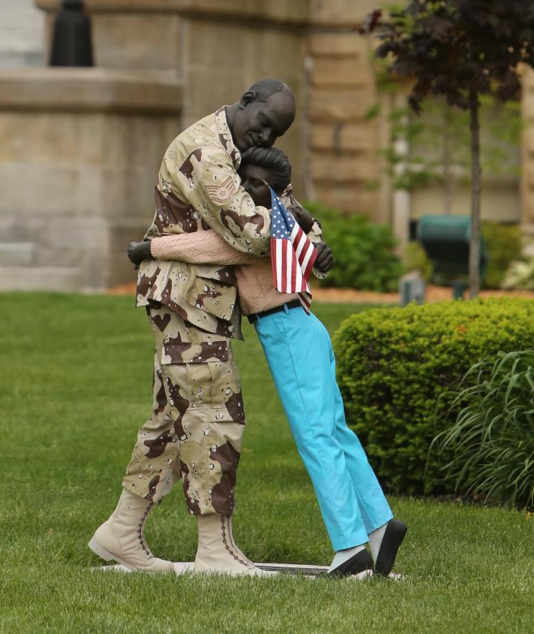 Coming Home Sculpture - Soldier hugging a loved one