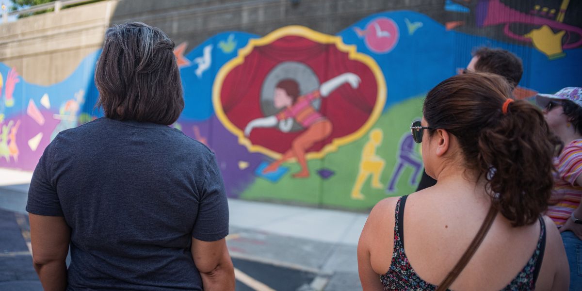 People look at mural