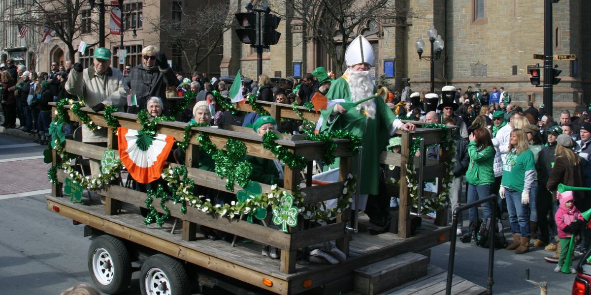 St. Patrick's Day parade float with crowd in background