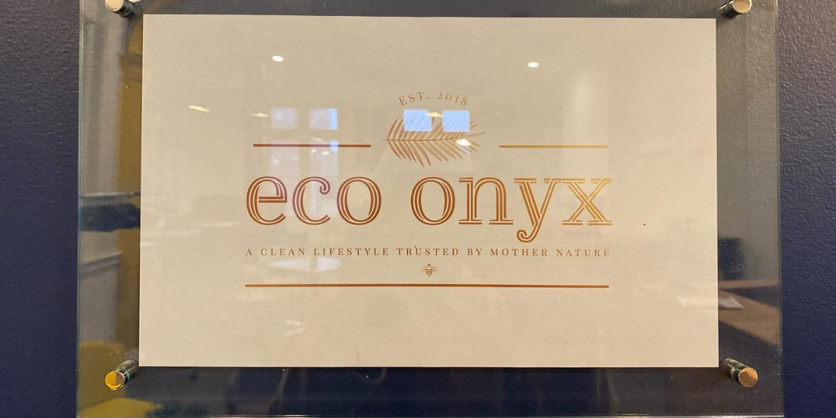 Sign on door reading eco onyx a clean lifestyle trusted by Mother Nature