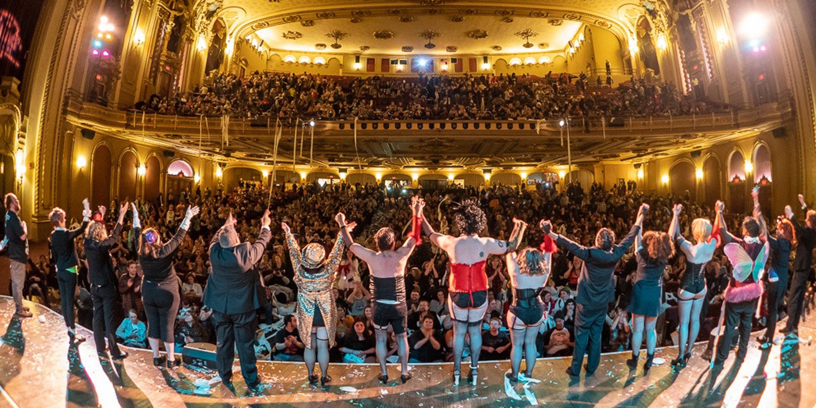 People stand in line on stage and face crowd