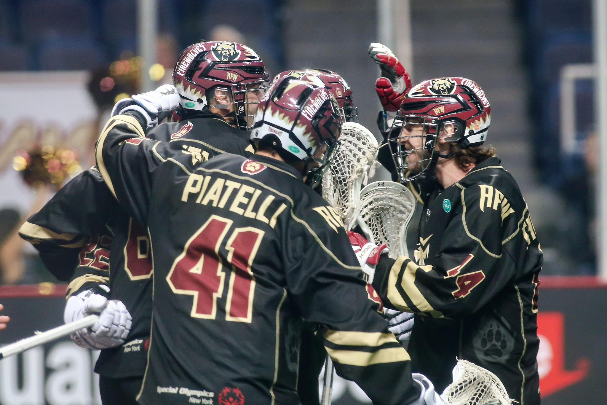 Lacrosse players in huddle