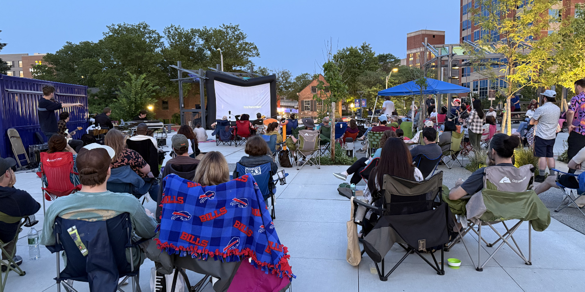 people at CMC watching a movie outside