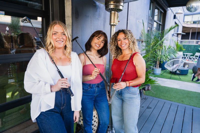 Group of women playing putt putt