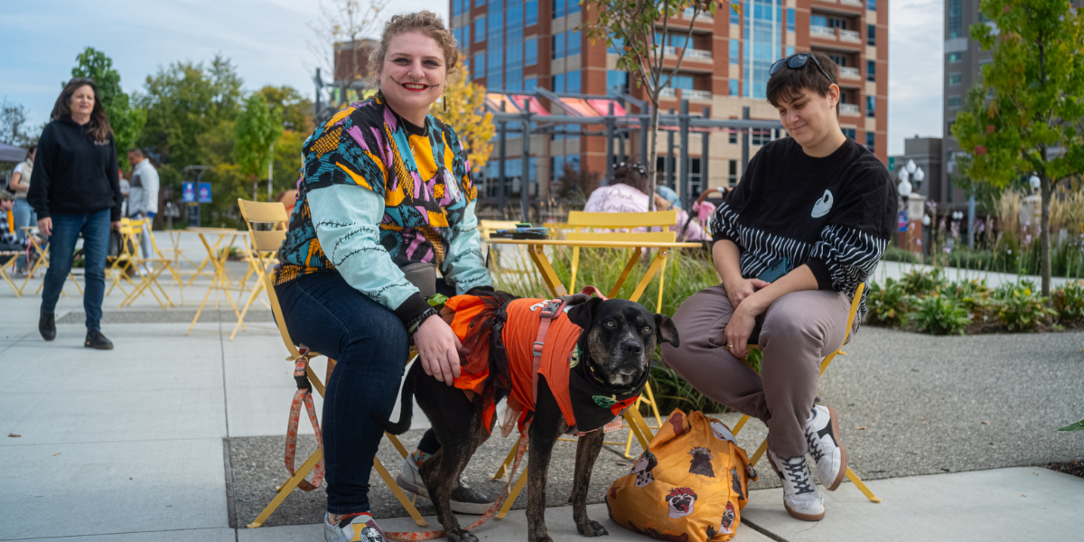 Dressed up guests and their costumed canine at Clinton Market Collective