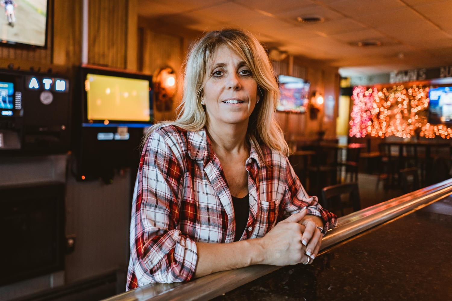 Employee smiling for photo inside Dawn's Victory Sports Café