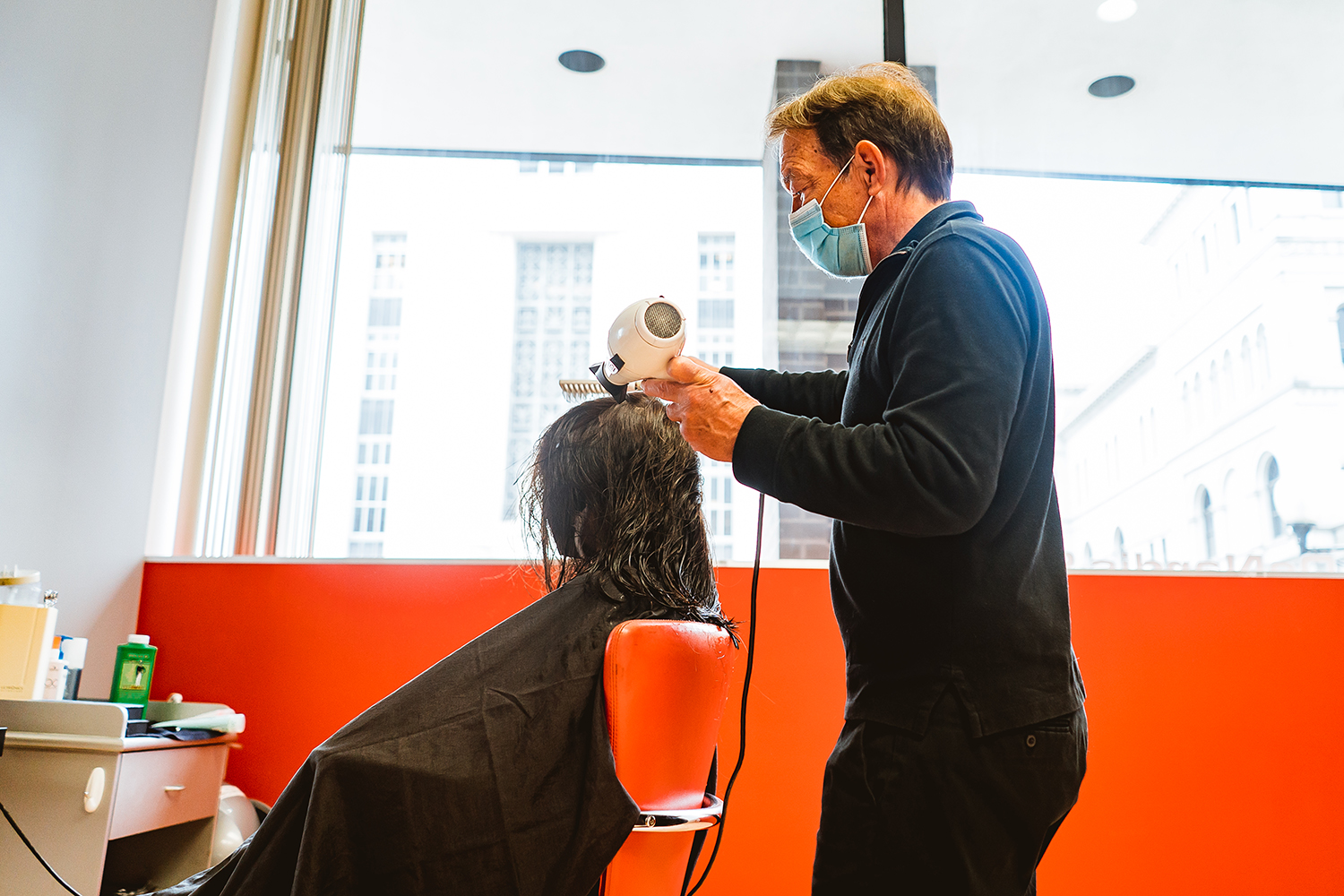 Woman receiving a blowout at salon