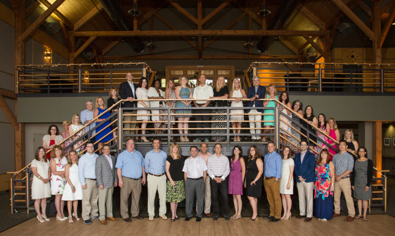 Staff on and in front of stairway