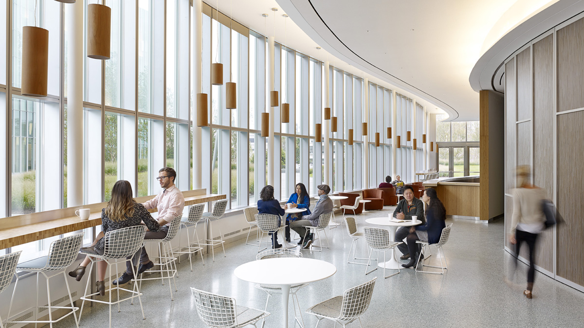 Circular hallway with 2-story windows and students