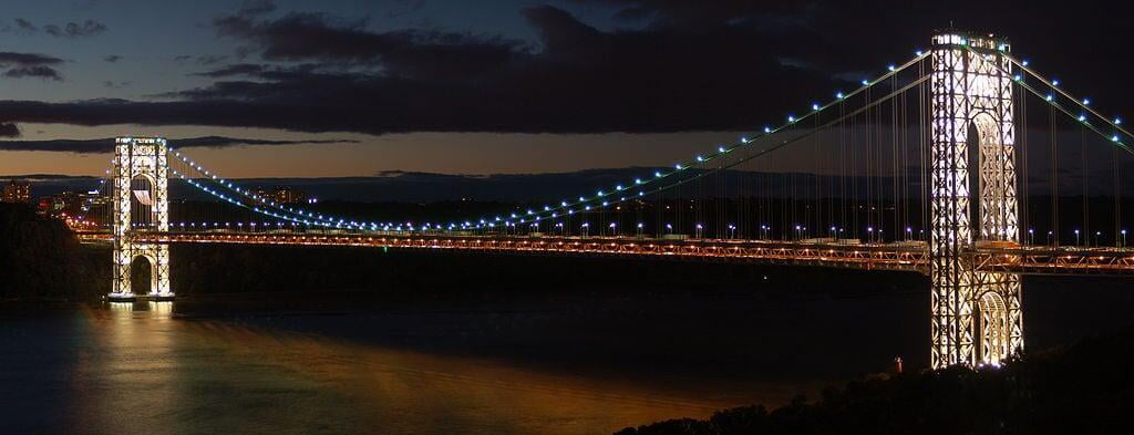 Suspension bridge lit up at night