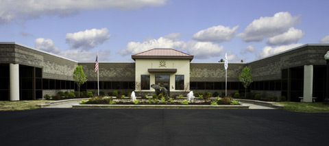Large 3-sided building with Trustco logo on center entrance