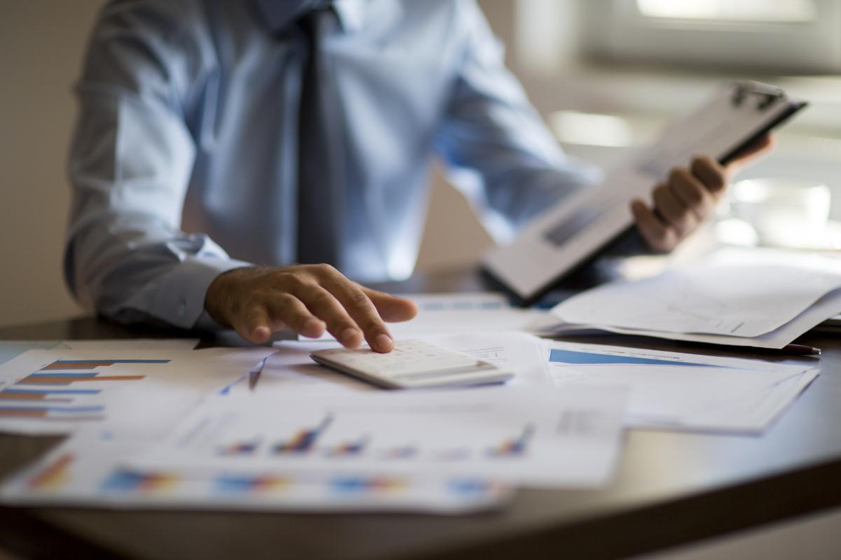 Man doing taxes at desk