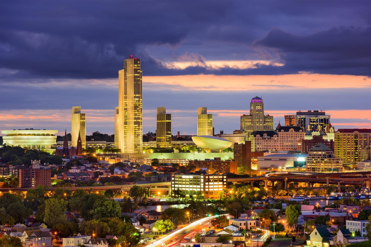 Albany, NY skyline at night with dramatic sky