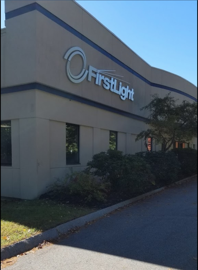 Firstlight logo on stone building