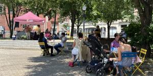 People sitting in a park in downtown Albany