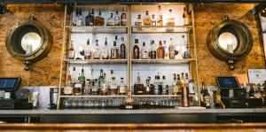 Bar shelves shown with registers at either side