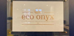 Sign on door reading eco onyx a clean lifestyle trusted by Mother Nature