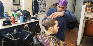 Man receives haircut