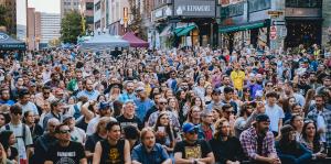 Crowd of people watching a concert at PearlPalooza 2023 on N Pearl Street