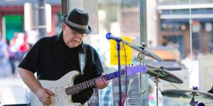 man playing guitar at the hollow