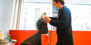 Woman receiving a blowout at salon