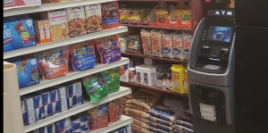 Grocery shelves, ATM inside market