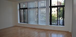 Living area with hardwood floors and window view