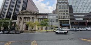 Zoomed-out photo of outside of 66 State Street and surrounding buildings