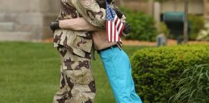 Coming Home Sculpture - Soldier hugging a loved one