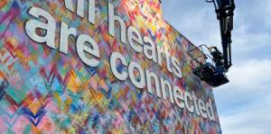 Mural saying All hearts are connected