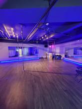 pole dance practice room with mirrors.
