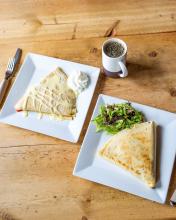 two crepes sitting on the table