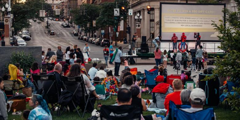 People attending outdoor movie.