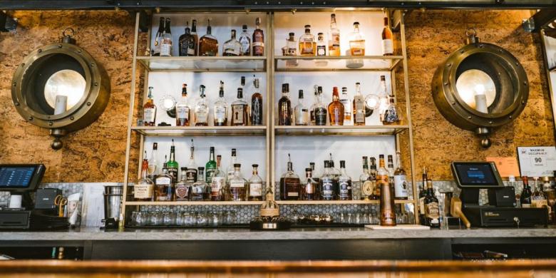 Bar shelves shown with registers at either side