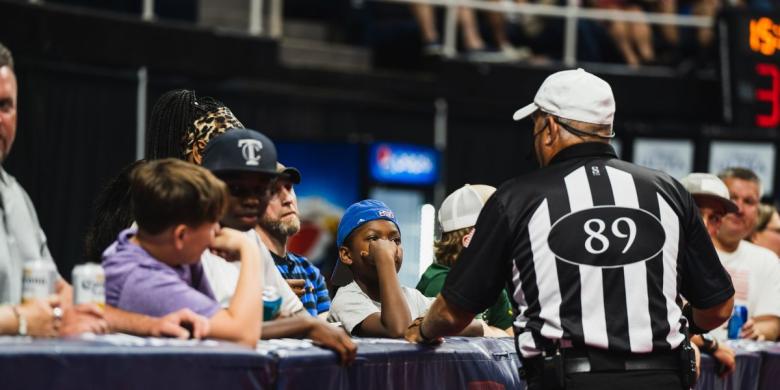 Referee looks at event attendees