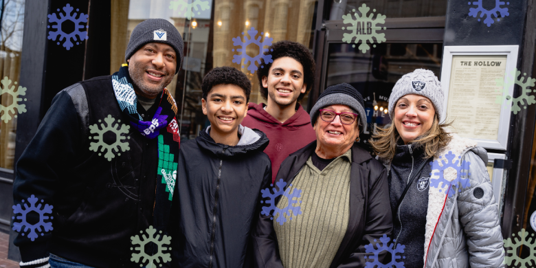 A family at a store in downtown with Snowflake icons around them