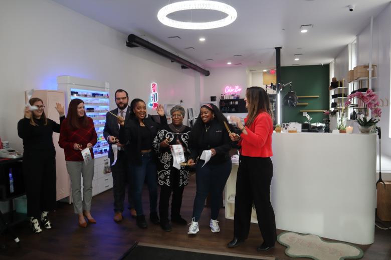 People celebrating the ribbon cutting at STUDIO23