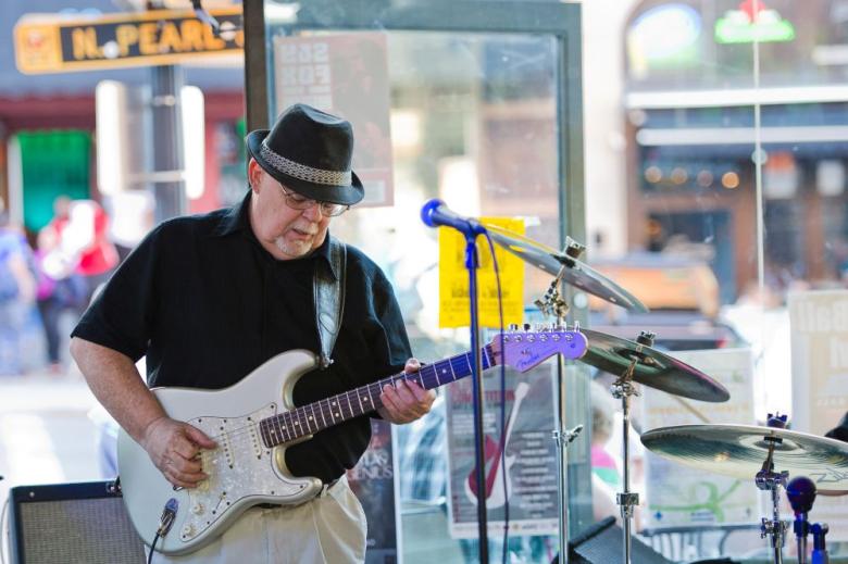 man playing guitar at the hollow