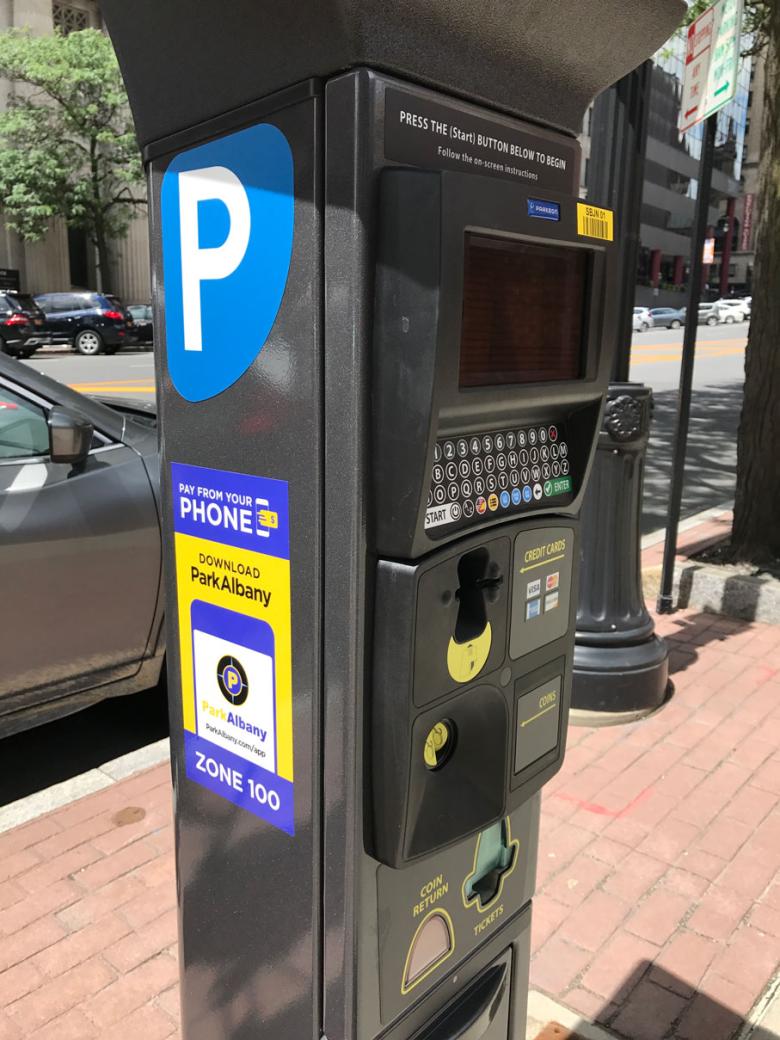 Parking meter on the sidewalk 