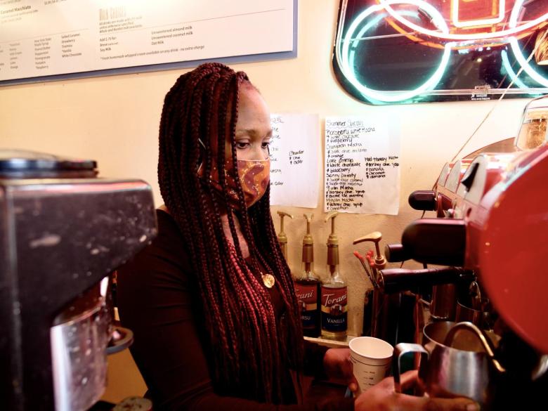 Employee making drink